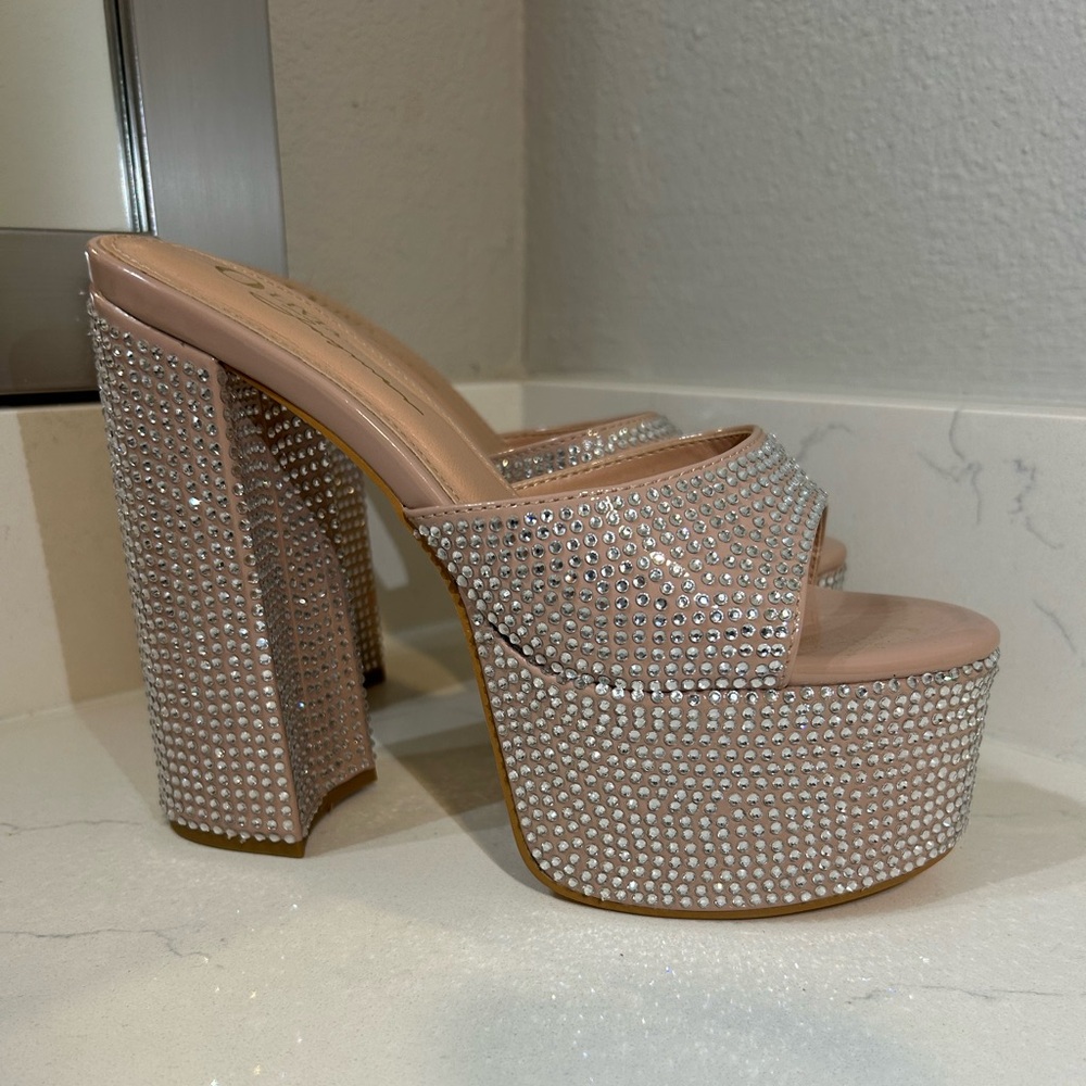 High platform rhinestone heels. Only worn twice.